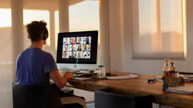 A man attending a zoom meeting