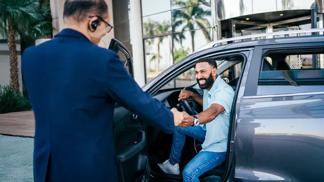 Two men doing a fist bump