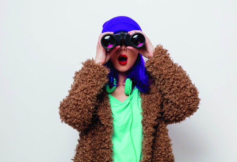 Person looking through binoculars