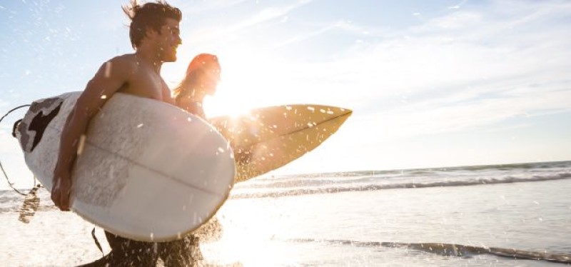 Two surfers on the shore