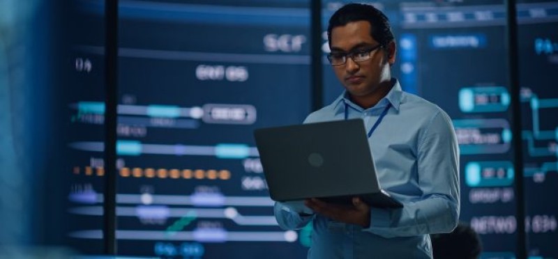 A man seriously looking at his laptop